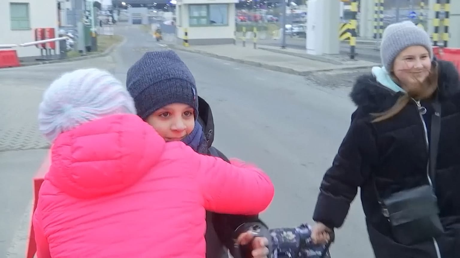 Family members hugging each other as they reunite