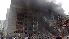 Firefighters work to extinguish a fire at a damaged city center after Russian air raid in Chernigiv, Ukraine, March 3, 2022. 