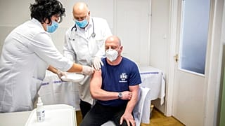 FILE: gettting vaccinated at the university in Szeged, Hungary, Feb. 24, 2021. (Tibor Rosta/MTI via AP)
