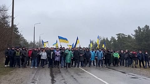 Video footage shared by Enerhodar's City Council showed people en masse standing on the street and blocking the entrance to the city in Enerhodar, Ukraine, on March, 3, 2022.