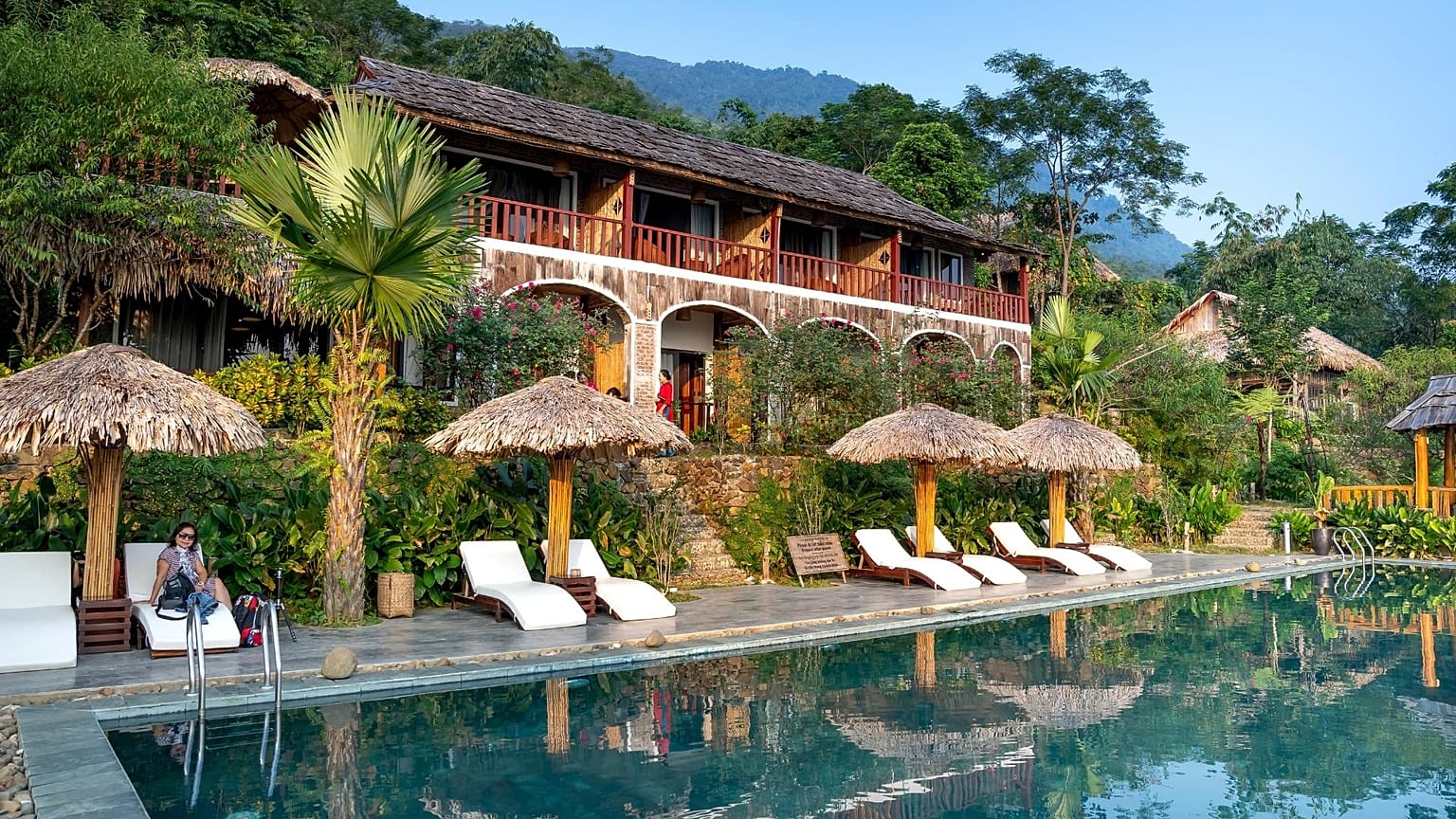 A hotel surrounded by trees