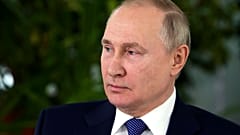 Russian President Vladimir Putin speaks to representatives of the flight crew of Russian airlines as he visits to Aeroflot Aviation School outside Moscow, Russia