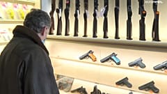 A shopper in a gun shop 