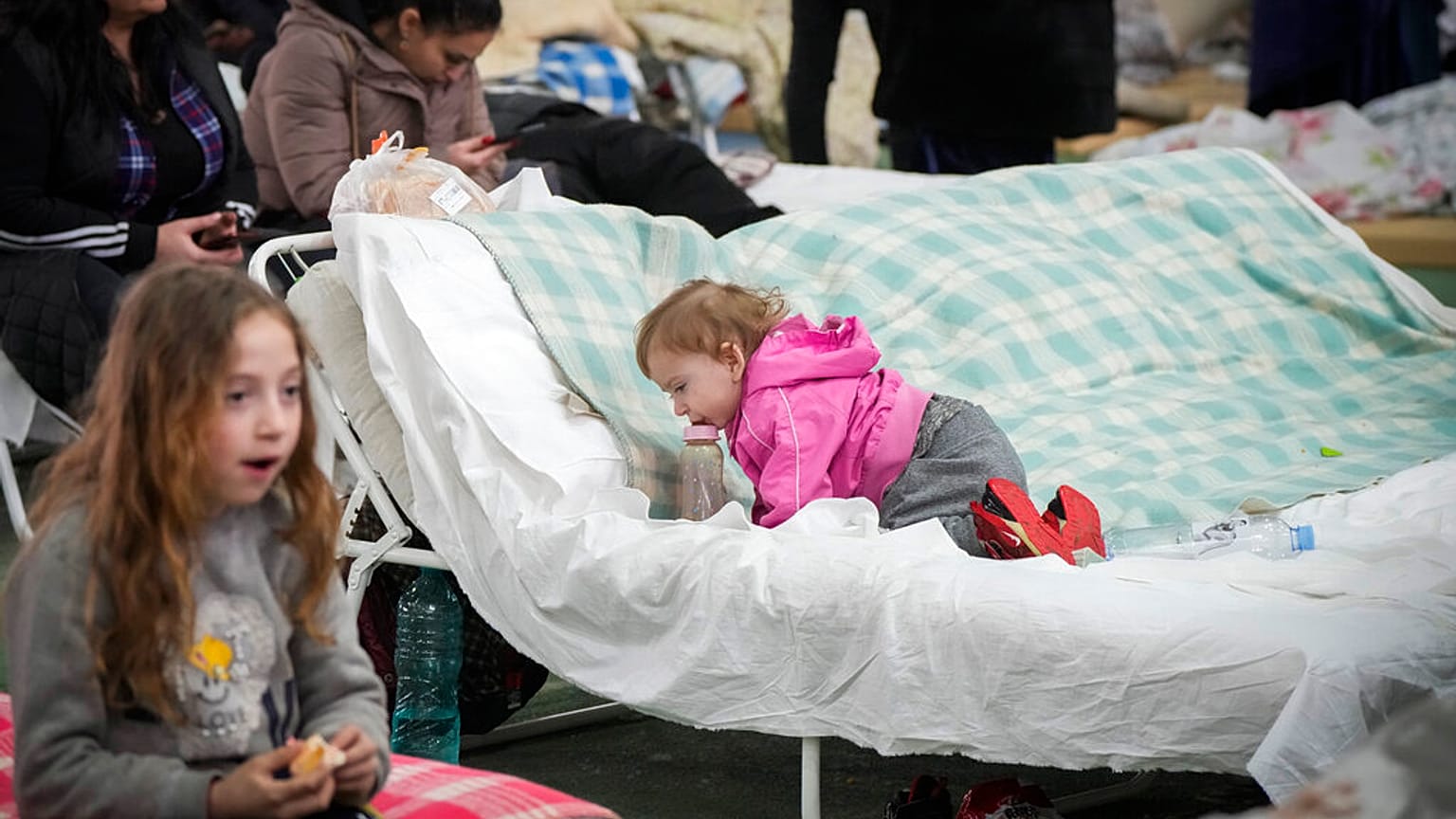 Refugees from Ukraine rest inside a facility for refugees in Chisinau, Moldova, Saturday, March 5, 2022. 