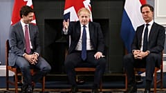 Canadian Prime Minister Justin Trudeau, British Prime Minister Boris Johnson and Dutch Prime Minister Mark Rutte sit during a meeting in London.