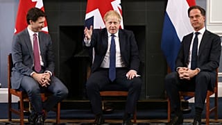 Canadian Prime Minister Justin Trudeau, British Prime Minister Boris Johnson and Dutch Prime Minister Mark Rutte sit during a meeting in London.