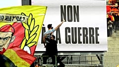 A sign saying 'No to war' over Russia's invasion of Ukraine is seen at the Ligue 1 match between RC Lens and Brest at Lens' Stade Bollaert, northern France, March 5, 2022.