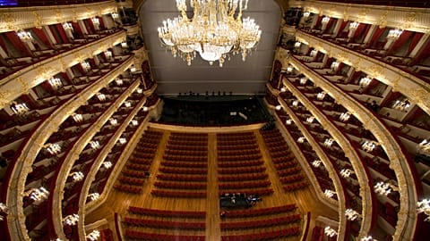 A chandelier hangs over the main hall in the Bolshoi Theater during a press tour organized by the theater's restorers, Moscow, Russia, Saturday, Oct. 8, 2011