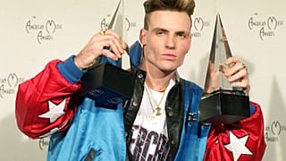 Vanilla Ice displays his awards he won in the rock and rap catagories at the American Music Awards in Los Angeles, Calif., on Jan. 28, 1991