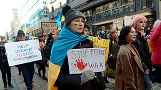 People hold banners and Ukrainian flags during a protest against the Russia invasion, in Helsinki, Saturday, March 5, 2022
