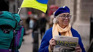 A demonstrator protests against the British government's response to the Russian invasion of Ukraine  in London, Wednesday, March 9, 2022.