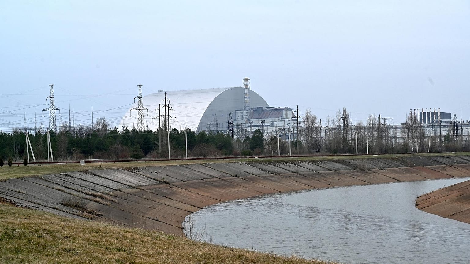 A picture taken on April 13, 2021 shows the giant protective dome built over the sarcophagus covering the destroyed fourth reactor of the Chernobyl Nuclear Power Plant.