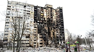 This picture shows an apartment building damaged after shelling the day before in Ukraine's second-biggest city of Kharkiv on March 8, 2022.