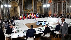 President Macron hosts his counterparts at the Palace of Versailles.