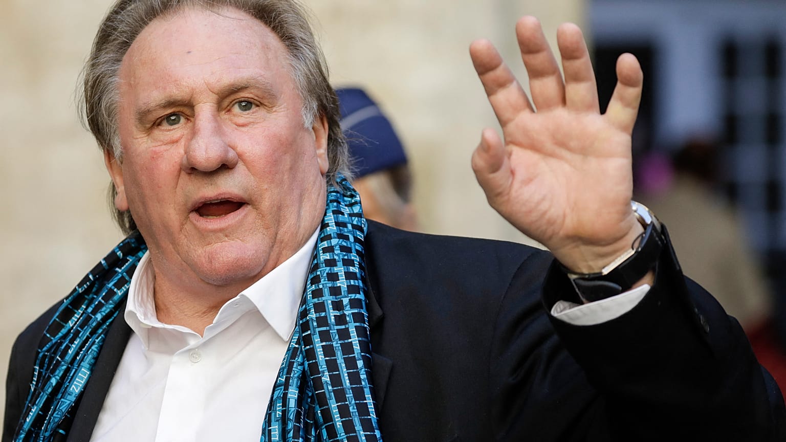 June 25, 2018, French actor Gerard Depardieu waves as he arrives at the Town Hall in Brussels