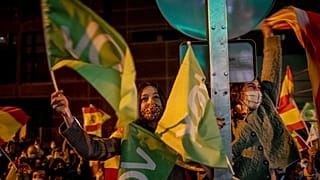 People gather outside the Vox party headquarters in Madrid last May.