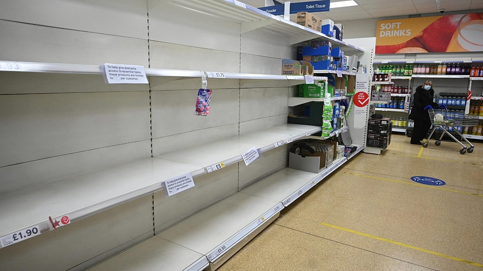 Empty shelves which previously held toilet paper are pictured at a supermarket in Cleckheaton, West Yorkshire during the COVID-19 pandemic. 