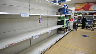 Empty shelves which previously held toilet paper are pictured at a supermarket in Cleckheaton, West Yorkshire during the COVID-19 pandemic. 