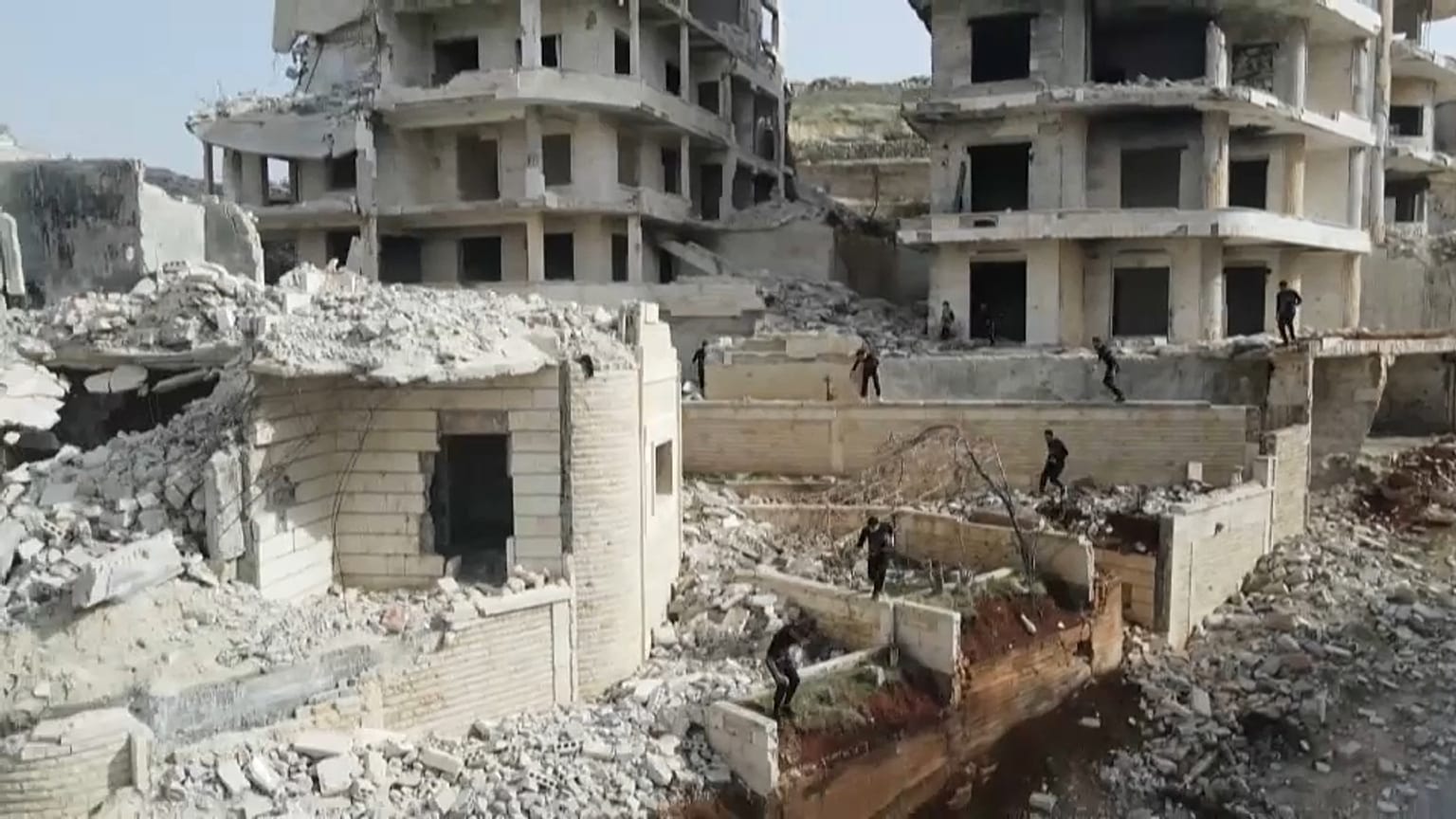 Young Syrian 'parkour' aficionados practise acrobatic moves and backflips in the war-ravaged Syrian town of Ariha, in the rebel-held northwestern Idlib province.