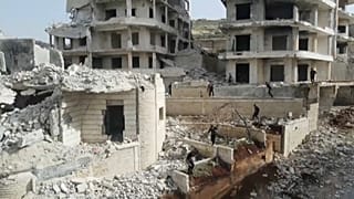 Young Syrian 'parkour' aficionados practise acrobatic moves and backflips in the war-ravaged Syrian town of Ariha, in the rebel-held northwestern Idlib province.
