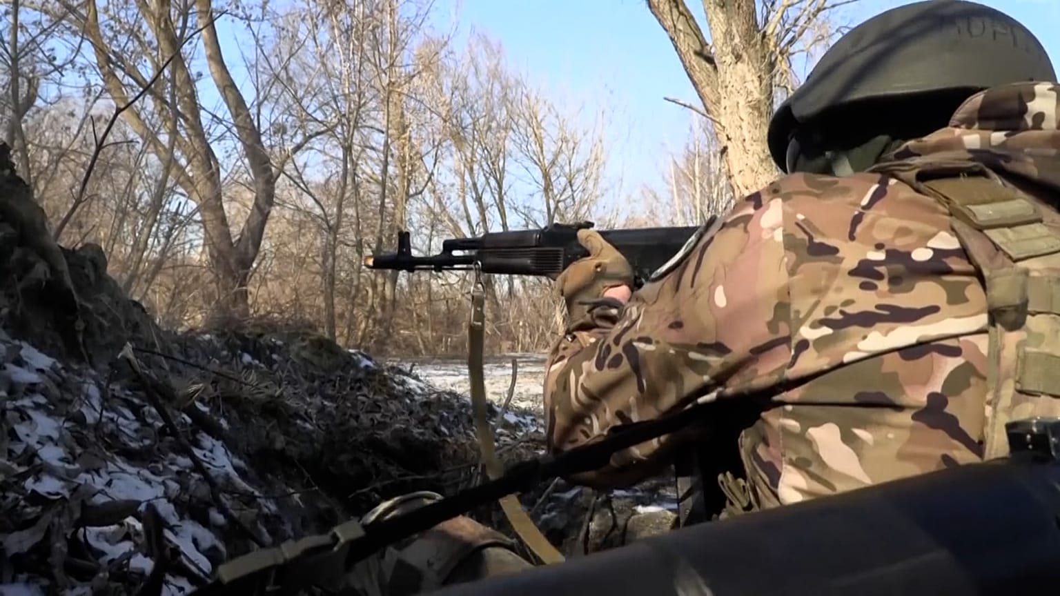 Soldiers firing weapons