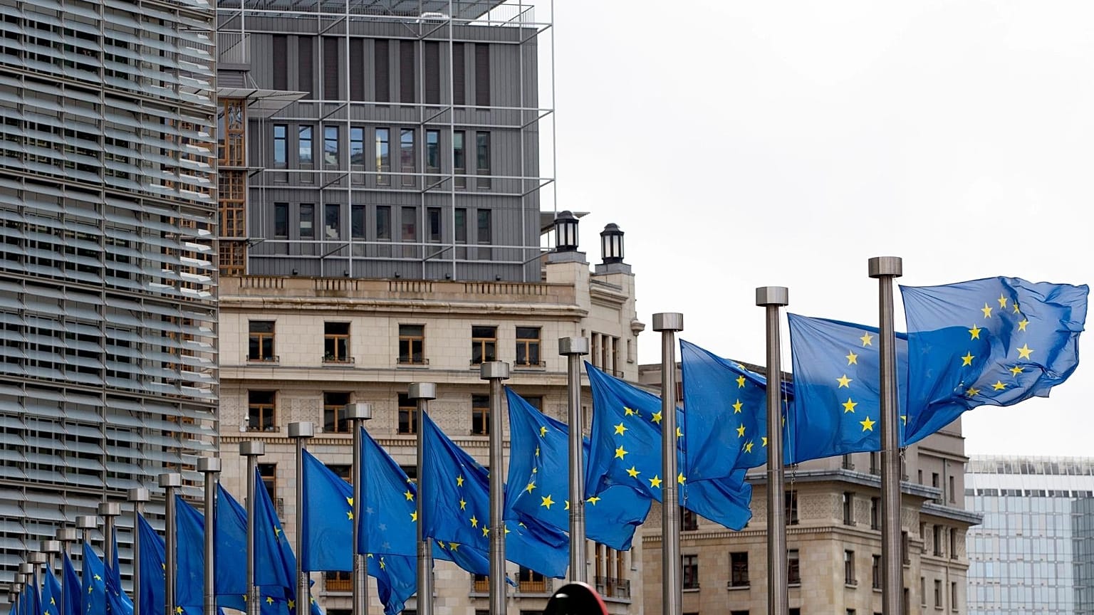 File: European Union flags outside EU headquarters in Brussels