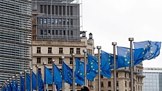 File: European Union flags outside EU headquarters in Brussels