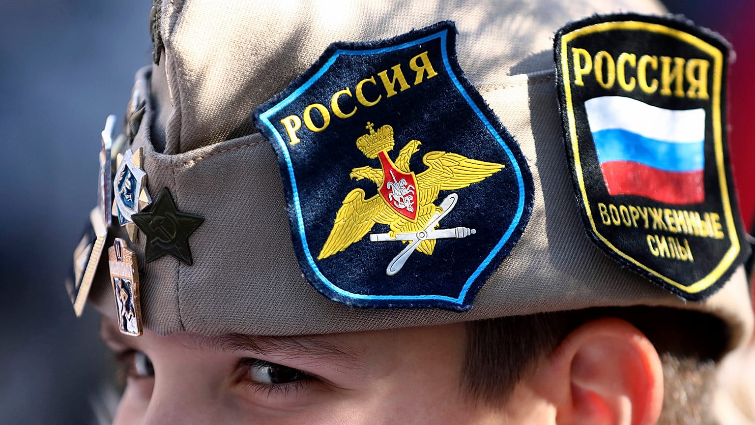 A boy wears Russian insignia on his hat as he rallies in Banjaluka, Bosnia, Saturday, 12 March 2022