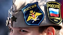 A boy wears Russian insignia on his hat as he rallies in Banjaluka, Bosnia, Saturday, 12 March 2022