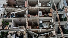 Пострадавший в результате бомбардировок жилой дом в Харькове, 13 марта 2022