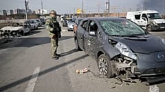 Footage released by police in Kyiv on Sunday, shows burnt out and damaged vehicles following attacks on a partially destroyed bridge in Irpin