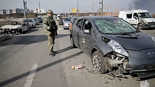 Footage released by police in Kyiv on Sunday, shows burnt out and damaged vehicles following attacks on a partially destroyed bridge in Irpin