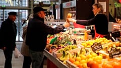 Customers no longer have to wear facemasks at a market in Biarritz, southwestern France.