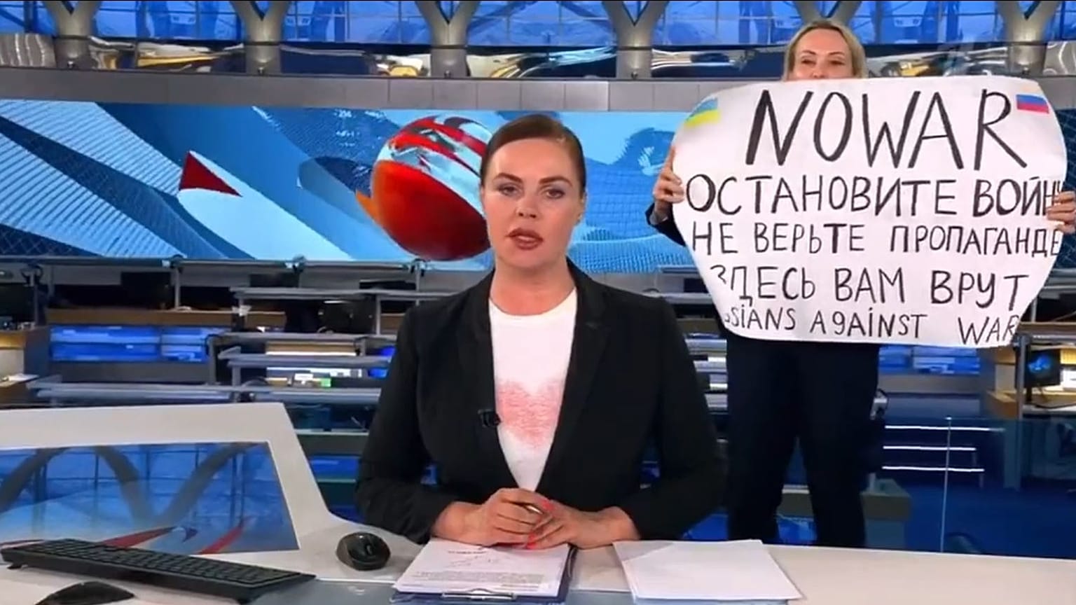 This photo reportedly shows an anti-war protester interrupting the Channel One broadcast.