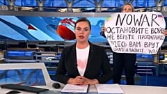 This photo reportedly shows an anti-war protester interrupting the Channel One broadcast.