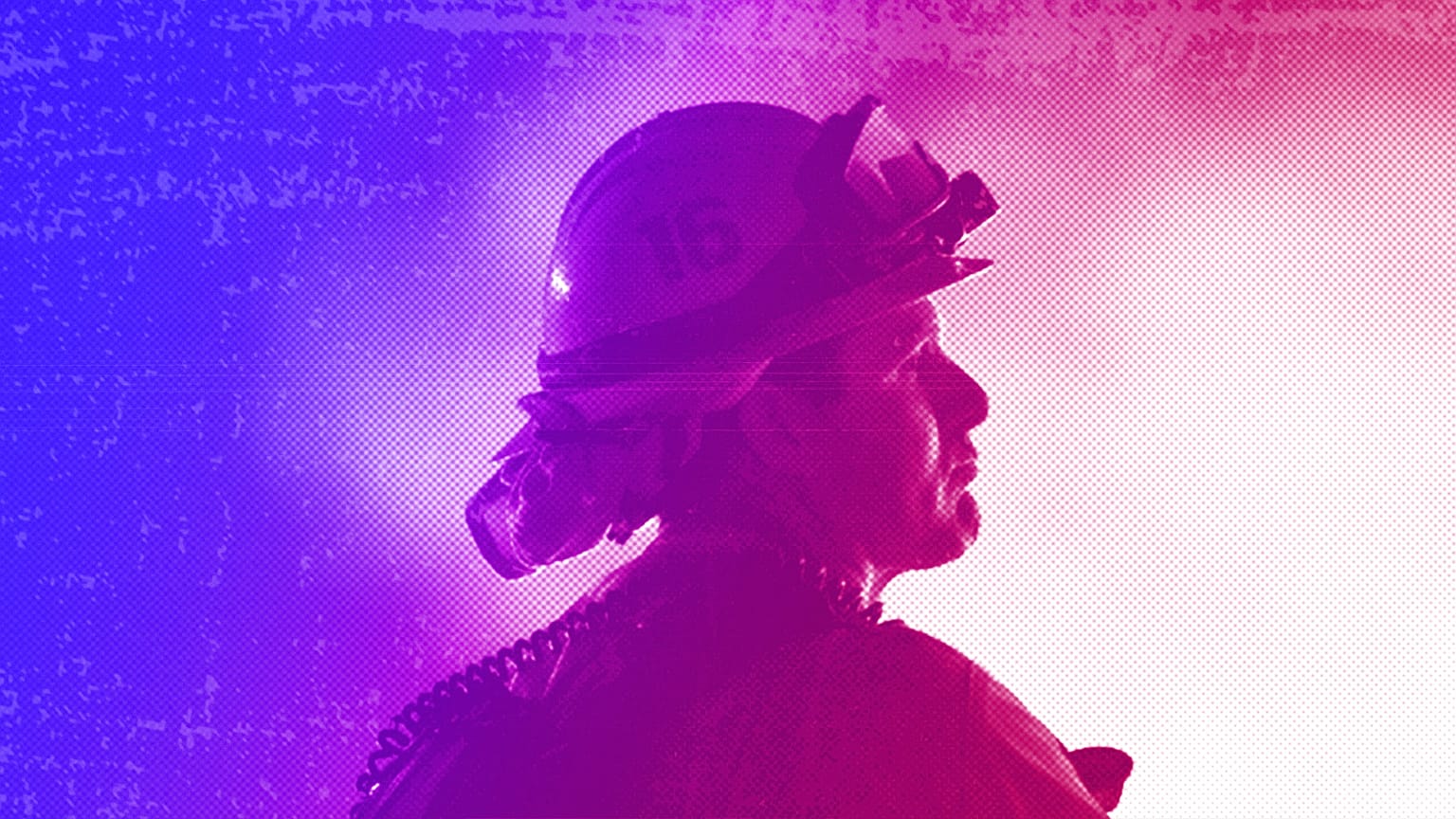 A firefighter watches flames in Moreno Valley, CA, July 2023