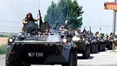  Russian soldiers drive their military armored vehicles