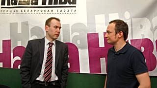 Nasha Niva journalist Andrey Skurko (R) pictured at their editorial office in Minsk in 2011.