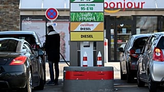 A driver fills his car tank in a petrol station in Marseille, southern France.