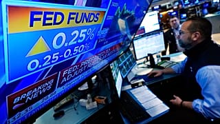 A television screen on the floor of the New York Stock Exchange, Wednesday, March 16, 2022