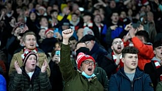 Sunderland fans cheer during the English League Cup quarterfinal match between Arsenal and Sunderland at Emirates stadium in London, Tuesday, Dec. 21, 2021