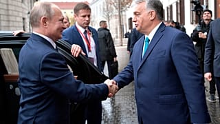 Hungarian Prime Minister Viktor Orban, right, greets Russian President Vladimir Putin upon his arrival in Budapest, Hungary, Wednesday, 30 Oct, 2019