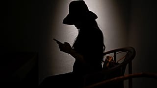 This picture taken on July 16, 2021 shows Melissa using her mobile phone to message her virtual boyfriend - a chatbot created by XiaoIce, a cutting-edge artificial intelligenc
