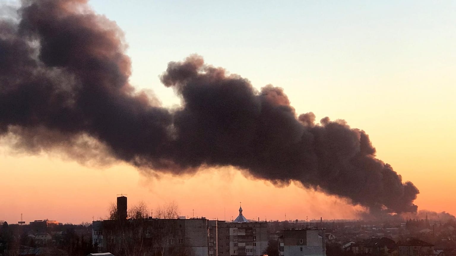 A cloud of smoke raises after an explosion in Lviv, western Ukraine, Friday, March 18, 2022.