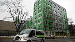 In this file photo taken on Friday, Oct. 27, 2017, a car of Russian state-owned television station RT passes by the company's office in Moscow, Russia.