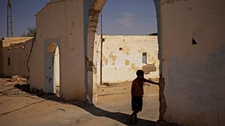 A Sahrawi refugee boy stands in the shadow in the Boujdour refugee camp.