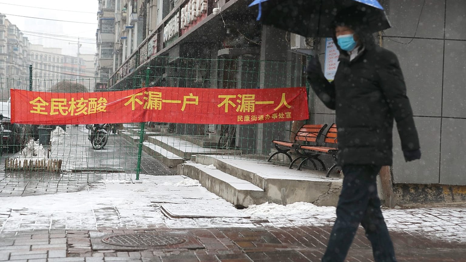 A slogan reads "All citizens Covid test, don't miss any household, don't miss any person" during a city wide lockdown, Changchun, China's Jilin province, March 14, 2022.