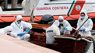 Italian forensic police inspect the damage on the boat in Salo on Lake Garda.