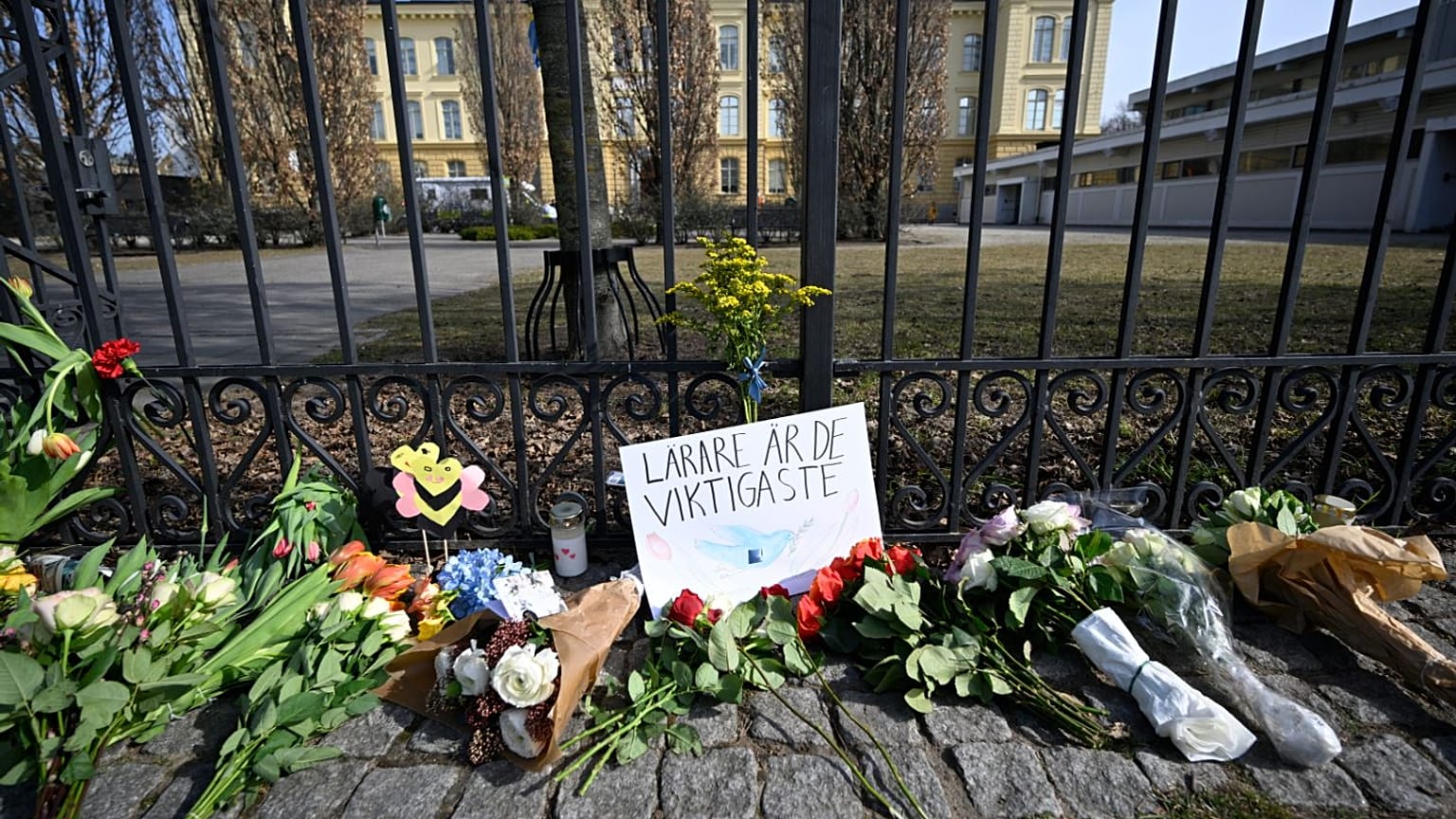 Floral tributes outside the Malmo Latin School on Tuesday, including a message that reads "Teachers are the most important".