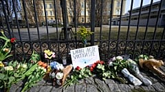 Floral tributes outside the Malmo Latin School on Tuesday, including a message that reads "Teachers are the most important".